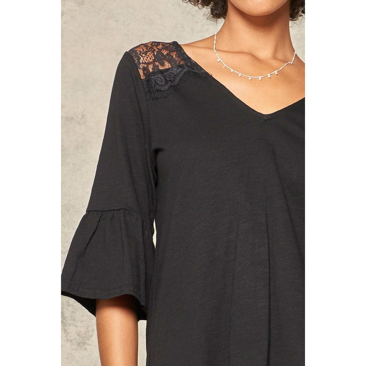 A Knit Top With Deep V Neckline And Yoke Design