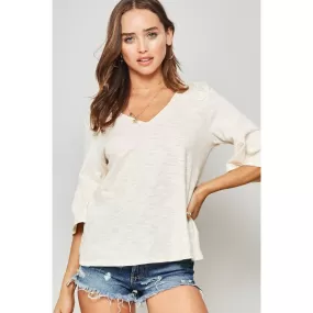 A Knit Top With Deep V Neckline And Yoke Design